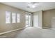Bright bedroom featuring a ceiling fan, and large windows filling the space with natural light at 2821 S Skyline Dr # 149, Mesa, AZ 85212