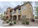 Charming townhome showcasing stone accents, a balcony, and low-maintenance landscaping at 2821 S Skyline Dr # 149, Mesa, AZ 85212