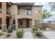 Inviting townhome featuring a covered entry, balcony, stone accents, and xeriscaped front yard at 2821 S Skyline Dr # 149, Mesa, AZ 85212