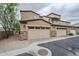 Attached garage with stylish stone accents and low maintenance desert landscaping at 2821 S Skyline Dr # 149, Mesa, AZ 85212