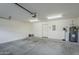 Bright and spacious garage featuring a water heater, water softener, and ample storage space at 2821 S Skyline Dr # 149, Mesa, AZ 85212