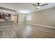 Open-concept living space with wood-look flooring, modern ceiling fan, and great natural light at 2821 S Skyline Dr # 149, Mesa, AZ 85212