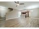 Spacious open floor plan with wood-look floors connecting living, dining, and kitchen areas at 2821 S Skyline Dr # 149, Mesa, AZ 85212