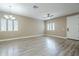 Open living room featuring tile floors, a modern ceiling fan, and natural light from white-framed windows at 2821 S Skyline Dr # 149, Mesa, AZ 85212