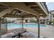 View from a shaded ramada overlooking the community pool and spa area at 2821 S Skyline Dr # 149, Mesa, AZ 85212