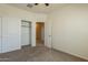 Cozy bedroom with a closet and neutral walls, ready for personalization and comfort at 29870 W Weldon Ave, Buckeye, AZ 85396