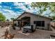 Private backyard featuring a relaxing hot tub, covered patio, and desert landscaping perfect for outdoor living at 29915 N Maravilla Dr, San Tan Valley, AZ 85143
