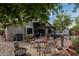 Spacious backyard featuring a dining area, hot tub, fire pit, and decorative landscaping, perfect for outdoor living at 29915 N Maravilla Dr, San Tan Valley, AZ 85143