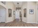 Inviting foyer with hardwood floors, high ceilings and decorative wall niches at 29915 N Maravilla Dr, San Tan Valley, AZ 85143