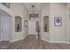 Elegant foyer with high ceilings, arched alcoves, and wood-look flooring that creates a grand entrance at 29915 N Maravilla Dr, San Tan Valley, AZ 85143