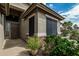 Inviting front entrance with decorative stone accents and desert landscaping, creating a welcoming atmosphere at 29915 N Maravilla Dr, San Tan Valley, AZ 85143