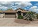 Charming single-story home with a well-manicured front yard, desert landscaping and a two-car garage at 29915 N Maravilla Dr, San Tan Valley, AZ 85143