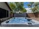 Inviting hot tub surrounded by well-maintained landscaping, perfect for relaxation and enjoying the backyard at 29915 N Maravilla Dr, San Tan Valley, AZ 85143