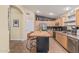 Well-lit kitchen featuring stainless steel appliances and wood cabinetry at 29915 N Maravilla Dr, San Tan Valley, AZ 85143