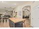Open-concept kitchen with a butcher block island and modern finishes at 29915 N Maravilla Dr, San Tan Valley, AZ 85143