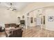 Open living space with wood floors, light walls, and comfortable seating at 29915 N Maravilla Dr, San Tan Valley, AZ 85143