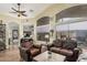 Comfortable living room featuring large windows and stylish furniture at 29915 N Maravilla Dr, San Tan Valley, AZ 85143