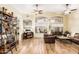 Bright living room with high ceilings, wood floors, and ample natural light at 29915 N Maravilla Dr, San Tan Valley, AZ 85143