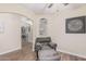 Bright and airy living room features neutral paint and wood floors at 29915 N Maravilla Dr, San Tan Valley, AZ 85143