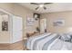 Cozy main bedroom with wood-look floors and ensuite bathroom at 29915 N Maravilla Dr, San Tan Valley, AZ 85143