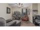 Home office with ceiling fan, hardwood floors, and ample space for a comfortable work environment at 29915 N Maravilla Dr, San Tan Valley, AZ 85143
