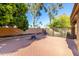 A lovely backyard offers a brick patio with a charming fire pit, perfect for entertaining and creating cozy moments at 3002 S Marigold Pl, Chandler, AZ 85248