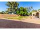 Large backyard featuring a mix of gravel and lawn space, providing ample room for outdoor recreation and relaxation at 3002 S Marigold Pl, Chandler, AZ 85248