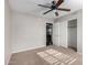 Bedroom with neutral carpet, a ceiling fan, and a closet, offering ample storage space and a comfortable retreat at 3002 S Marigold Pl, Chandler, AZ 85248