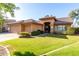 Charming home featuring a well-maintained front yard, tiled roof and a three-car garage at 3002 S Marigold Pl, Chandler, AZ 85248