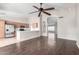 Open concept living space showcasing laminate flooring, modern light fixtures and a ceiling fan at 3002 S Marigold Pl, Chandler, AZ 85248