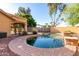 Relaxing backyard pool featuring stone accents, perfect for cooling off and enjoying sunny days in a private oasis at 3002 S Marigold Pl, Chandler, AZ 85248
