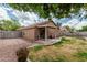 This backyard features a lawn, a patio, and a fence at 3212 W Lucia Dr, Phoenix, AZ 85083