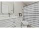 Bathroom featuring a modern vanity with stylish fixtures and a shower with a striped curtain at 3212 W Lucia Dr, Phoenix, AZ 85083