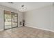 An open-concept dining area features sliding glass doors to the backyard and modern lighting at 3212 W Lucia Dr, Phoenix, AZ 85083