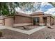 Tan home featuring a two car garage and desert landscaping, with a sidewalk leading to the front door at 3212 W Lucia Dr, Phoenix, AZ 85083