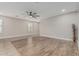 The spacious living room features a ceiling fan, stylish flooring, and lots of natural light at 3212 W Lucia Dr, Phoenix, AZ 85083