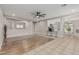 An open-concept living room leads to the kitchen with an island and bar seating at 3212 W Lucia Dr, Phoenix, AZ 85083