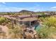 Stunning aerial view of the property with a pool, spa, outdoor kitchen, and meticulously landscaped backyard at 3217 N Piedra Cir, Mesa, AZ 85207