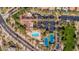 Community aerial view featuring swimming pool, tennis courts, parking, and community center at 3217 N Piedra Cir, Mesa, AZ 85207