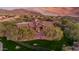 Magnificent home with manicured lawn and desert landscaping; mountains and neighborhood visible in background at 3217 N Piedra Cir, Mesa, AZ 85207