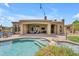 Backyard featuring covered patio, outdoor seating, and a stunning pool at 3217 N Piedra Cir, Mesa, AZ 85207
