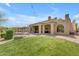 Expansive backyard with a swimming pool, spa, and outdoor living spaces at 3217 N Piedra Cir, Mesa, AZ 85207