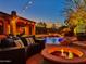 Inviting backyard with pool, spa, fire pit and ample seating; perfect for outdoor relaxation and entertainment at 3217 N Piedra Cir, Mesa, AZ 85207