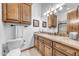 Well-appointed bathroom featuring a marble countertop, wood cabinets and ample storage space at 3217 N Piedra Cir, Mesa, AZ 85207