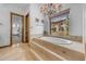 Bathroom featuring a soaking tub with beautiful views of the surrounding desert landscape at 3217 N Piedra Cir, Mesa, AZ 85207