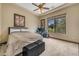 Bedroom with a large window and natural light features desert landscaping views and a comfortable setup at 3217 N Piedra Cir, Mesa, AZ 85207