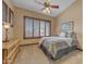 Relaxing bedroom boasts shuttered windows, neutral colors, and a cozy ambiance for peaceful nights at 3217 N Piedra Cir, Mesa, AZ 85207