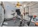 Bright workout room with wood accent wall, state-of-the-art equipment and lots of natural light at 3217 N Piedra Cir, Mesa, AZ 85207