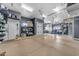 Spacious garage with epoxy flooring and ample storage solutions, including overhead racks and shelving at 3217 N Piedra Cir, Mesa, AZ 85207