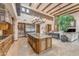 Gourmet kitchen and living room offer great flow for entertaining with an island and custom cabinets at 3217 N Piedra Cir, Mesa, AZ 85207